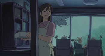 Movie still from “Ponyo” (2008), directed by Hayao Miyazaki – An animated woman standing in front of an open window; Medium shot, Over the shoulder angle