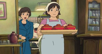 Movie still from “Ponyo” (2008), directed by Hayao Miyazaki – An animated woman holding a tray of bowls; Medium shot, Low angle