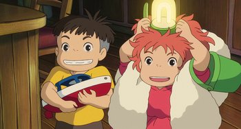 Movie still from “Ponyo” (2008), directed by Hayao Miyazaki – Two children are holding a toy and a light; Medium shot, Low angle