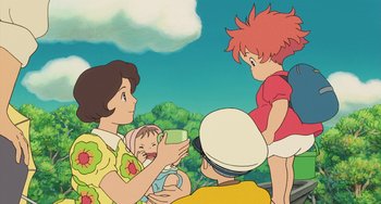 Movie still from “Ponyo” (2008), directed by Hayao Miyazaki – A group of people standing next to each other in a field; Medium shot, Over the shoulder angle