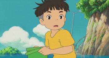 Movie still from “Ponyo” (2008), directed by Hayao Miyazaki – A cartoon of a boy holding a piece of paper; Close Up shot, High angle