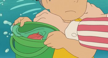 Movie still from “Ponyo” (2008), directed by Hayao Miyazaki – An animated picture of a person holding a bowl; Extreme Close Up shot, Overhead angle