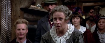 Movie still from “Popeye” (1980), directed by Robert Altman – A woman with a surprised look on her face; Close Up shot, Over the shoulder angle