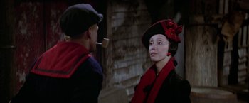 Movie still from “Popeye” (1980), directed by Robert Altman – A man and a woman talking to each other outside; Close Up shot, Over the shoulder angle