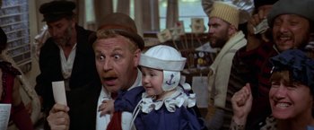 Movie still from “Popeye” (1980), directed by Robert Altman – A man and a child in sailor's outfits; Close Up shot, Over the shoulder angle