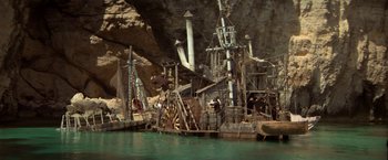 Movie still from “Popeye” (1980), directed by Robert Altman – A pirate ship in the middle of the water; Extreme Wide shot, High angle
