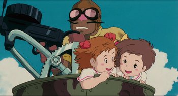 Movie still from “Porco Rosso” (1992), directed by Hayao Miyazaki – A group of children sitting on top of a boat; Medium shot, Low angle