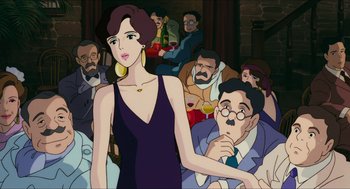 Movie still from “Porco Rosso” (1992), directed by Hayao Miyazaki – An animated scene of a woman and a man in front of a group of people; Medium shot, Over the shoulder angle