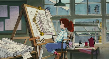 Movie still from “Porco Rosso” (1992), directed by Hayao Miyazaki – A woman sitting in front of a drawing board in a room; Wide shot, High angle