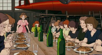 Movie still from “Porco Rosso” (1992), directed by Hayao Miyazaki – A group of people sitting at a table with wine bottles; Wide shot, High angle