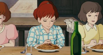 Movie still from “Porco Rosso” (1992), directed by Hayao Miyazaki – A woman sitting in front of a plate of spaghetti; Medium shot, High angle