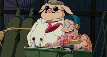Movie still from “Porco Rosso” (1992), directed by Hayao Miyazaki – Two cartoon characters sitting in front of a table; Medium shot, Low angle