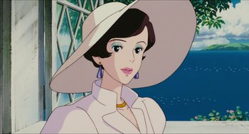 Movie still from “Porco Rosso” (1992), directed by Hayao Miyazaki – A woman in a white hat is looking at the camera; Close Up shot, Low angle