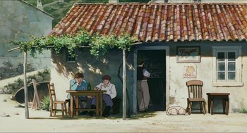Movie still from “Porco Rosso” (1992), directed by Hayao Miyazaki – Two men sitting at a table outside of a house; Wide shot, High angle