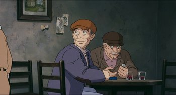 Movie still from “Porco Rosso” (1992), directed by Hayao Miyazaki – Two men sitting at a table with a drink in front of them; Medium shot, High angle