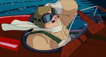 Movie still from “Porco Rosso” (1992), directed by Hayao Miyazaki – An animated pig wearing a hat and sunglasses; Medium shot, Low angle