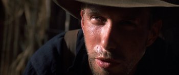 Movie still from “Posse” (1993), directed by Mario Van Peebles – A person wearing a hat; Close Up shot, Low angle