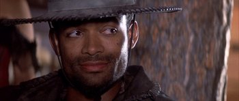 Movie still from “Posse” (1993), directed by Mario Van Peebles – A person wearing a hat; Close Up shot, Low angle