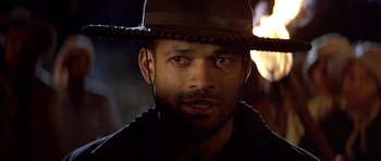 Movie still from “Posse” (1993), directed by Mario Van Peebles – A person wearing a hat; Close Up shot, Low angle
