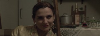 Movie still from “Post Mortem” (2010), directed by Pablo Larraín – A person wearing a dress; Close Up shot, Over the shoulder angle