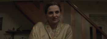 Movie still from “Post Mortem” (2010), directed by Pablo Larraín – A person wearing a robe; Close Up shot, Low angle