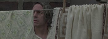 Movie still from “Post Mortem” (2010), directed by Pablo Larraín – A man looking at himself in the mirror; Close Up shot, Low angle