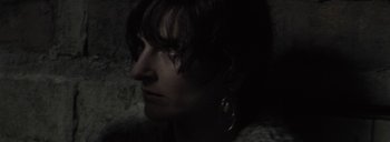 Movie still from “Post Mortem” (2010), directed by Pablo Larraín – A person's face in the dark; Close Up shot, Low angle