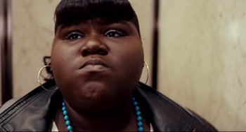 Movie still from “Precious” (2009), directed by Lee Daniels – A person wearing a necklace; Close Up shot, Low angle