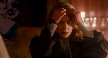 Movie still from “Precious” (2009), directed by Lee Daniels – A beautiful young lady holding her hand up to her head; Close Up shot, Low angle