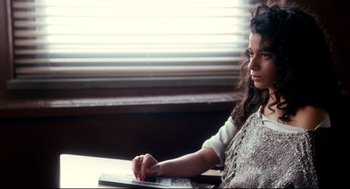 Movie still from “Precious” (2009), directed by Lee Daniels – A woman sitting in front of a computer keyboard; Medium shot, High angle