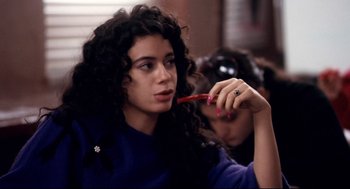 Movie still from “Precious” (2009), directed by Lee Daniels – A woman with curly hair is holding a red pencil; Close Up shot, Over the shoulder angle