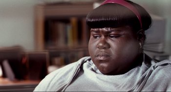 Movie still from “Precious” (2009), directed by Lee Daniels – A person with a wig on; Close Up shot, High angle