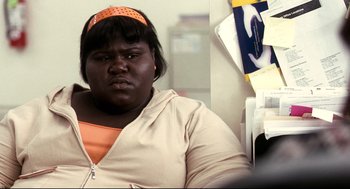 Movie still from “Precious” (2009), directed by Lee Daniels – A person wearing a headband; Close Up shot, Over the shoulder angle
