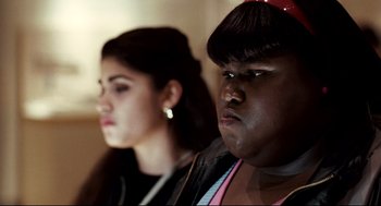 Movie still from “Precious” (2009), directed by Lee Daniels – Two women sitting next to each other in a room; Close Up shot, Over the shoulder angle
