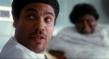Movie still from “Precious” (2009), directed by Lee Daniels – A person wearing a hat; Close Up shot, Over the shoulder angle