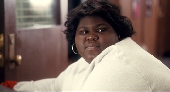 Movie still from “Precious” (2009), directed by Lee Daniels – A person wearing a white robe; Close Up shot, Over the shoulder angle