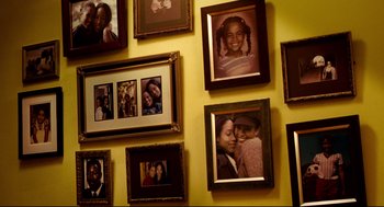 Movie still from “Precious” (2009), directed by Lee Daniels – A bunch of pictures hanging on a wall; Extreme Close Up shot, High angle