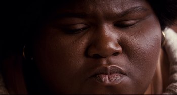 Movie still from “Precious” (2009), directed by Lee Daniels – A man's face with his eyes closed; Extreme Close Up shot, High angle