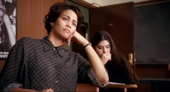 Movie still from “Precious” (2009), directed by Lee Daniels – A woman sitting next to another woman in front of a window; Medium shot, High angle