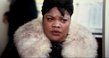 Movie still from “Precious” (2009), directed by Lee Daniels – A person wearing a fur coat; Close Up shot, Low angle