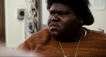 Movie still from “Precious” (2009), directed by Lee Daniels – A person wearing a sweater; Close Up shot, High angle