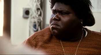 Movie still from “Precious” (2009), directed by Lee Daniels – A person wearing a sweater; Close Up shot, High angle
