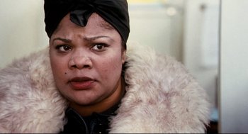 Movie still from “Precious” (2009), directed by Lee Daniels – A person wearing a coat; Close Up shot, High angle