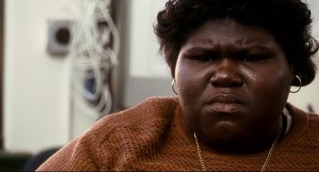 Movie still from “Precious” (2009), directed by Lee Daniels – A person wearing a sweater; Close Up shot, High angle