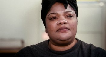 Movie still from “Precious” (2009), directed by Lee Daniels – A person wearing a turban; Close Up shot, Over the shoulder angle