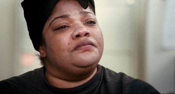 Movie still from “Precious” (2009), directed by Lee Daniels – A person wearing a hat; Close Up shot, High angle