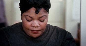 Movie still from “Precious” (2009), directed by Lee Daniels – A person wearing a head scarf; Close Up shot, High angle