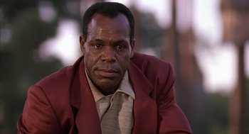 Movie still from “Predator 2” (1990), directed by Stephen Hopkins – A person wearing a jacket; Close Up shot, Low angle