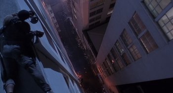 Movie still from “Predator 2” (1990), directed by Stephen Hopkins – Looking down at a city street at night; Wide shot, Overhead angle