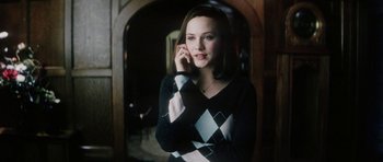 Movie still from “Pretty Persuasion” (2005), directed by Marcos Siega – A young woman is talking on a cell phone; Medium shot, High angle